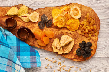 Dried fruits on wooden background
