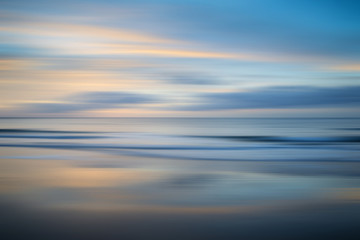 Beautiful long exposure blur sunrise landsdcape of idyllic Broadhaven Bay beach on Pembrokeshire...