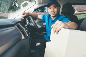 Delivery driver and packages on seat.