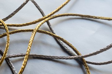 silver and gold twine on silver  background