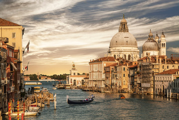 Grand Canal overlooking the Cathedral of Santa Maria della Salute and gondola with tourists, Venice, Italy