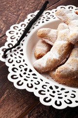 German Christmas pastries vanilla crescent vanillekipferl on plate. Christmas concept