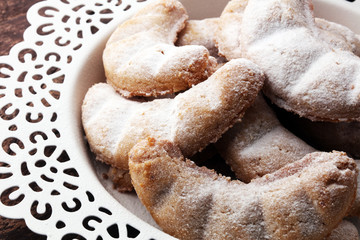 Fototapeta na wymiar German Christmas pastries vanilla crescent vanillekipferl on plate. Christmas concept