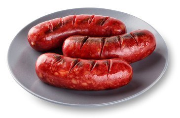 Grilled sausages cooked on a grill in gray plate