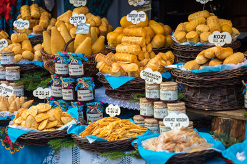 Traditional polish smoked cheese oscypek on christmas market in Cracow. Oscypek is made exclusively in Tatra Mountains region of Poland.