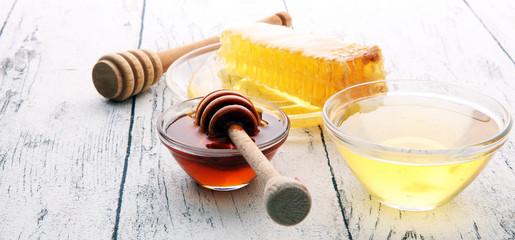 Honey in glass with honey dipper, Honeycomb, Honey Bee