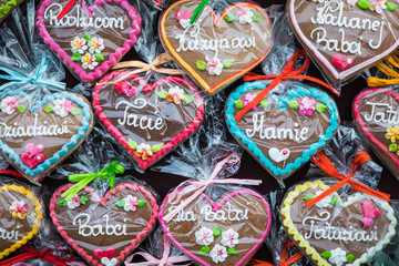 Gingerbread Hearts at Polish Christmas Market. Cracow. Xmas market in Poland. On traditional ginger bread cookies written "Dad, Mum,..." in Polish language.