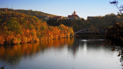 Beautiful castle Veveri in colorful autumn nature, gold leaf, Czech republic