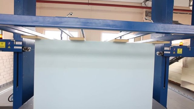 Closeup of polypropylene cube cutting machine, factory mattress, upholstery foam, focus