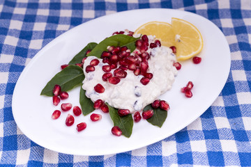 salad with chicken breasts, mayonnaise and pomegranate