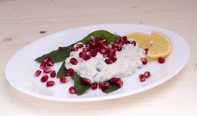 salad with chicken breasts, mayonnaise and pomegranate