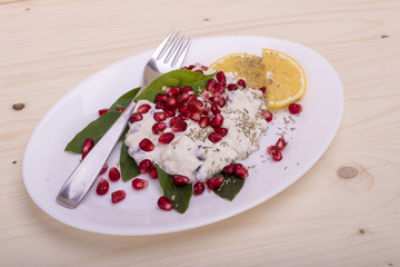 salad with chicken breasts, mayonnaise and pomegranate