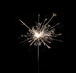 Fototapeta premium Burning sparkler on black background.