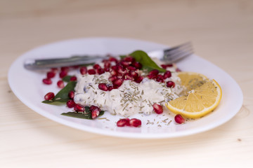 salad with chicken breasts, mayonnaise and pomegranate