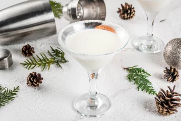 Rolgordijnen Ideas and recipes for Christmas drink. White Chocolate Snowflake Martini cocktail, on white marble table with Christmas decoration, copy space © ricka_kinamoto