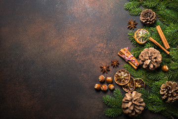 Obraz na płótnie Canvas Christmas spices and nuts on dark stone table. Top view copy space.