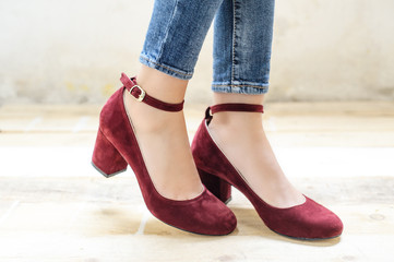 Vintage style shoes with heels worn on female legs with skinny jeans