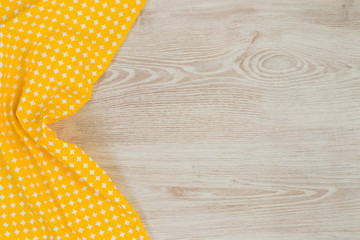 Cloth napkin on wooden background.