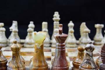 Alabaster chess pieces on board