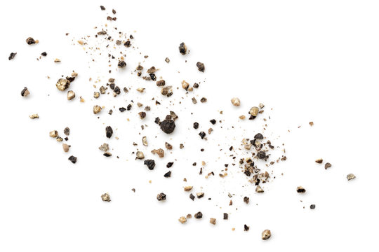 Crushed Black Peppercorns Scattered on White Background