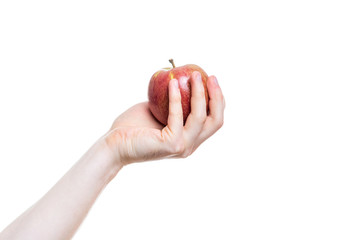 Holding an apple in the hand from below on white background