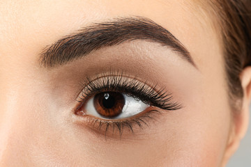 Obraz premium Beautiful young woman with eyelash extensions, closeup
