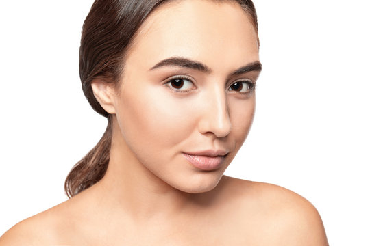 Portrait of beautiful young woman before applying eyelash extensions, on white background