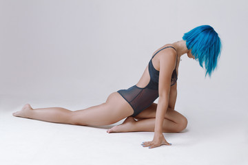 Naklejka premium Beautiful girl with a slender figure, tanned skin and short hair.