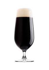 Cold glass of dark beer with foam and dew