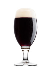 Cold glass of dark beer with foam and dew