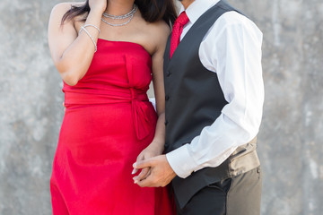 A couple dressed up with red outfit 