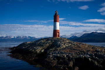 Les Eclaireurs Lighthouse, Beagle Channel, Ushuaia, Tierra del Fuego, Argentinia. The city of Ushuaia and the Martial Glacier are visible in the background to the left.