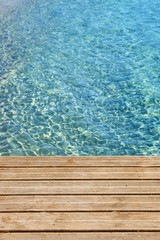 Fototapeta na wymiar Caribbean sea with wood wooden jetty and clear blue sea photo vertical