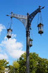 Lamp post against the sky