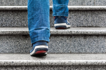 A man climbs the stairs