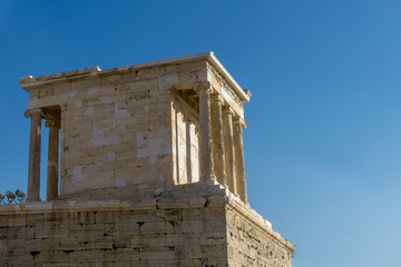 Naklejka premium The Erechtheion or Erechtheum is an ancient Greek temple on the Acropolis of Athens in Greece