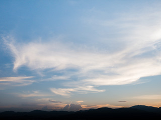 Fototapeta premium the beautiful blue sky with cloudy background and silhouette mountain in the evening