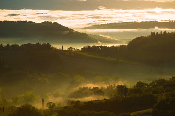 Dawn fog in the surroundings of San Gimignano. Tuscany, Italy