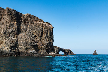 Fototapeta na wymiar Arch rock natural bridge and Anacapa Island in Channel Islands National Park off the coast of Ventura, California.