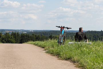 cyclists in a distance view on a summer sunny day © rudolfgeiger