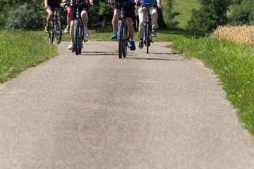 cyclists in a distance view on a summer sunny day © rudolfgeiger