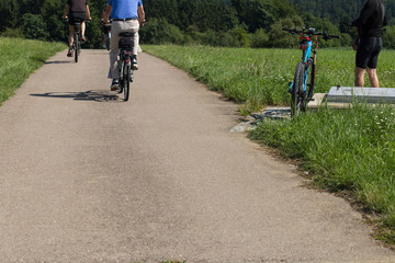 cyclists in a distance view on a summer sunny day © rudolfgeiger