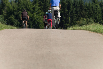 cyclists in a distance view on a summer sunny day © rudolfgeiger