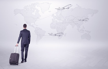 Businessman planning his trip over the world