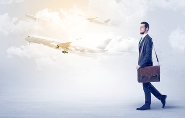 Businessman going somewhere with airplane