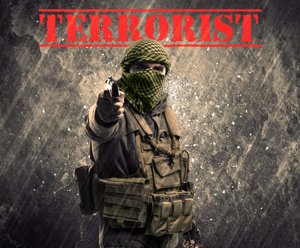 Dangerous masked and armed man with terrorist sign on grungy background