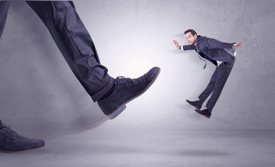 Foot kicking, businessman flying