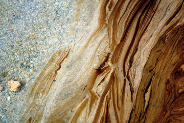 Athens, Greece, September 14 2017: Texture of crude oil spill on beach water - Greek oil spill spreads to Athens Riviera following the sinking of an oil tanker in Saronic Gulf.