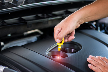 Car mechanic with wrenchCar mechanic repairing a car engine
