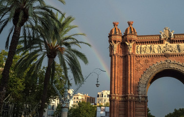 Fototapeta na wymiar Rainbow over the Arc de Triomphe in Barcelona.